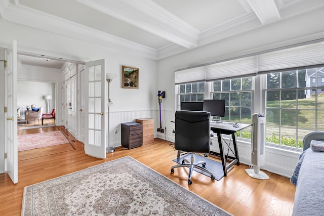 office space with light hardwood / wood-style flooring, beam ceiling, ornamental molding, and french doors