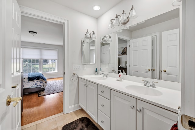 bathroom with vanity and hardwood / wood-style floors