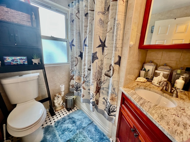 full bathroom featuring vanity, toilet, shower / bath combo, tile walls, and tile patterned flooring