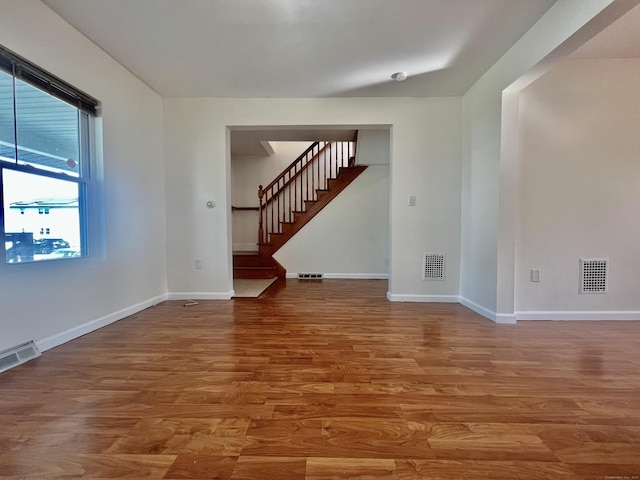 14 Bayview Pl, West Haven, CT 06516 - unfurnished room featuring wood finished floors, stairs, and baseboards