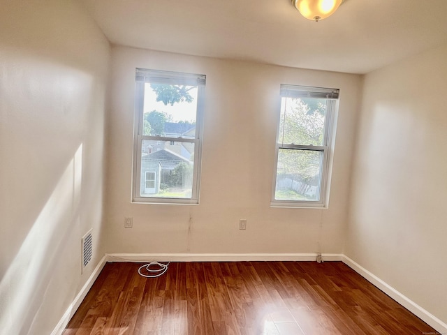 14 Bayview Pl, West Haven, CT 06516 - spare room featuring wood finished floors and baseboards