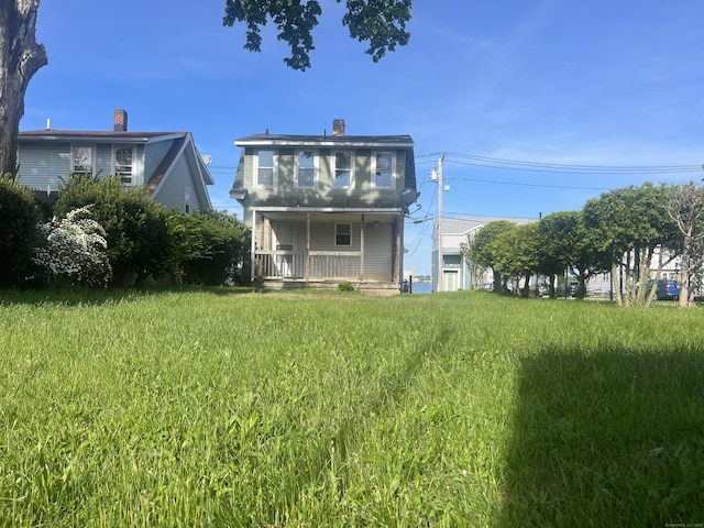 14 Bayview Pl, West Haven, CT 06516 - rear view of house with a porch and a chimney