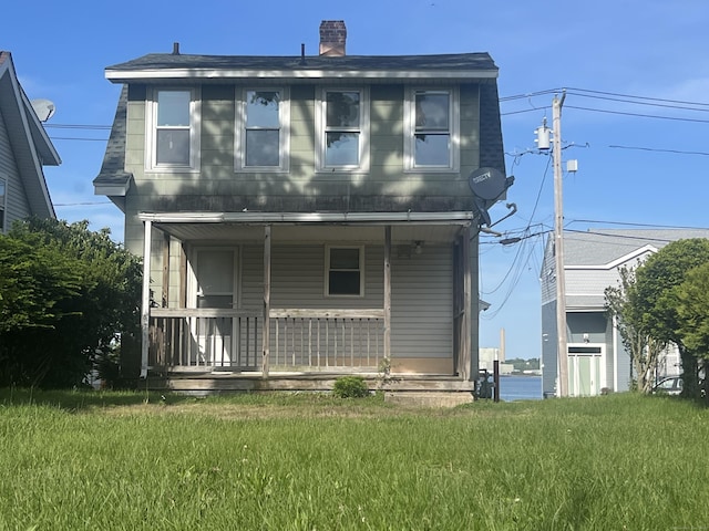 14 Bayview Pl, West Haven, CT 06516 - back of house featuring covered porch, a yard, and a chimney