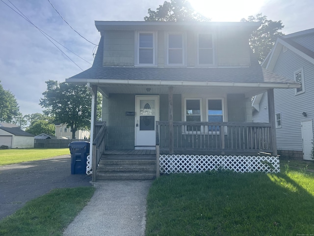14 Bayview Pl, West Haven, CT 06516 - bungalow-style home with covered porch, a shingled roof, and a front yard