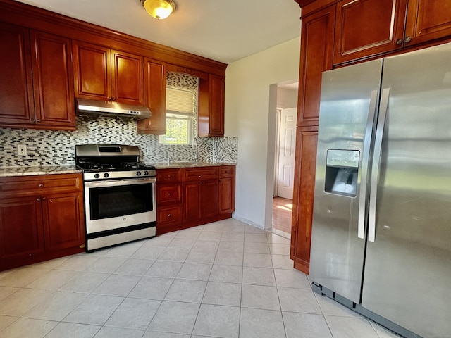 14 Bayview Pl, West Haven, CT 06516 - kitchen featuring appliances with stainless steel finishes, under cabinet range hood, decorative backsplash, reddish brown cabinets, and light stone counters