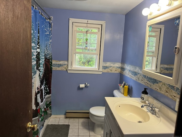 bathroom with vanity, toilet, a baseboard heating unit, and tile patterned floors