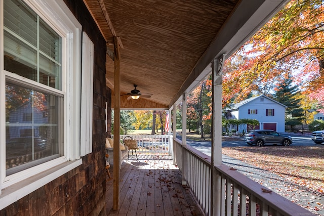 wooden deck with ceiling fan and a porch