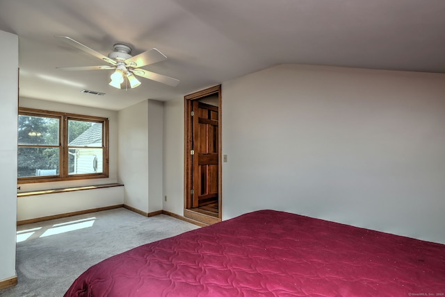 unfurnished bedroom with vaulted ceiling, ceiling fan, and carpet floors