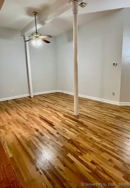 basement with ceiling fan and hardwood / wood-style flooring