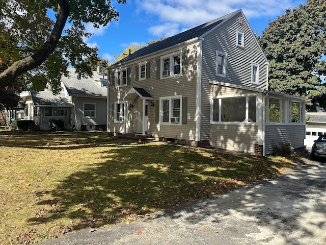 colonial home with cooling unit and a front lawn