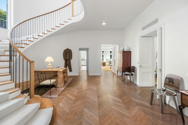 entrance foyer featuring parquet floors