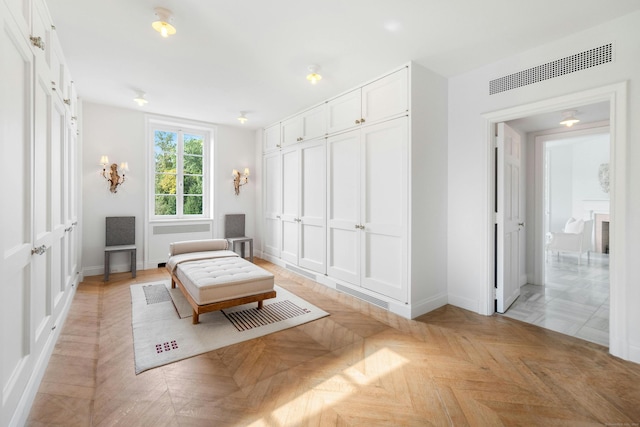 living area featuring light parquet flooring