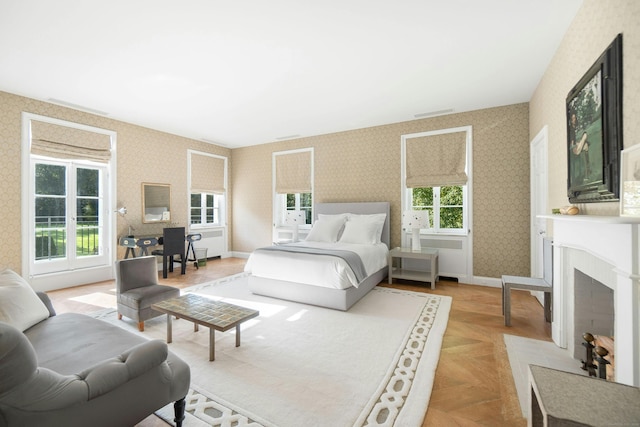 bedroom featuring light parquet flooring