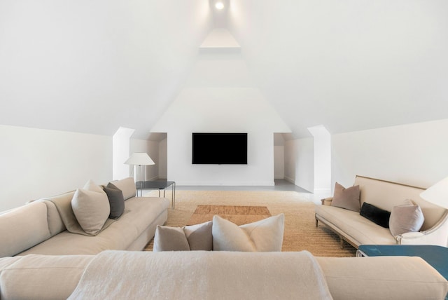 living room with vaulted ceiling and light carpet