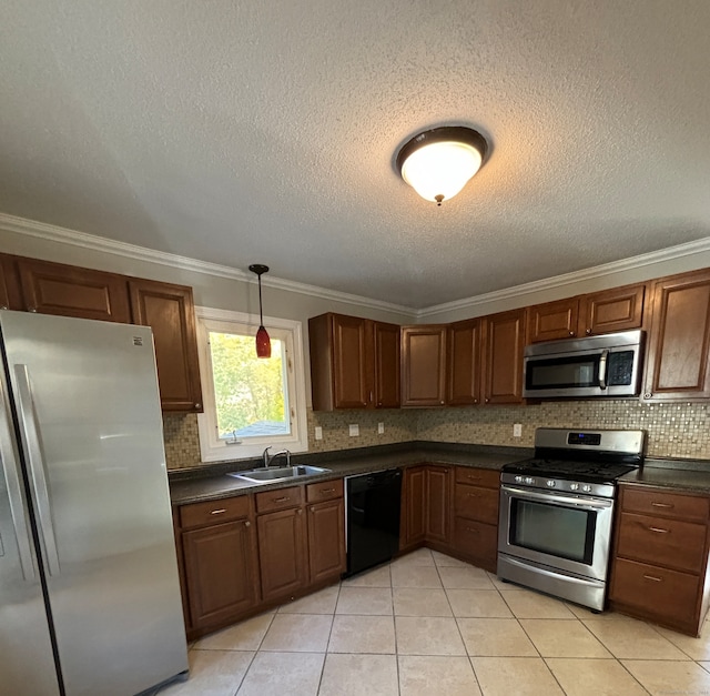 kitchen featuring a textured ceiling, stainless steel appliances, sink, and crown molding