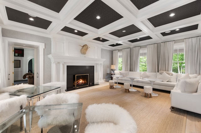 living room with crown molding, coffered ceiling, beam ceiling, and a wealth of natural light