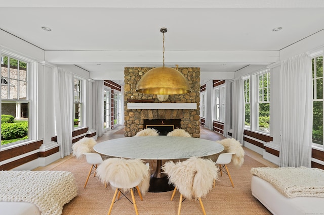 9 Cowdray Park Dr, Greenwich, CT 06831 - sunroom / solarium featuring beamed ceiling, baseboards, plenty of natural light, and wood finished floors