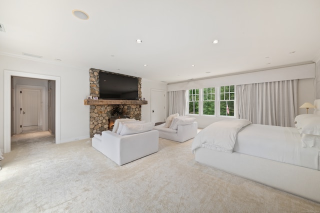 carpeted living room with a stone fireplace and ornamental molding