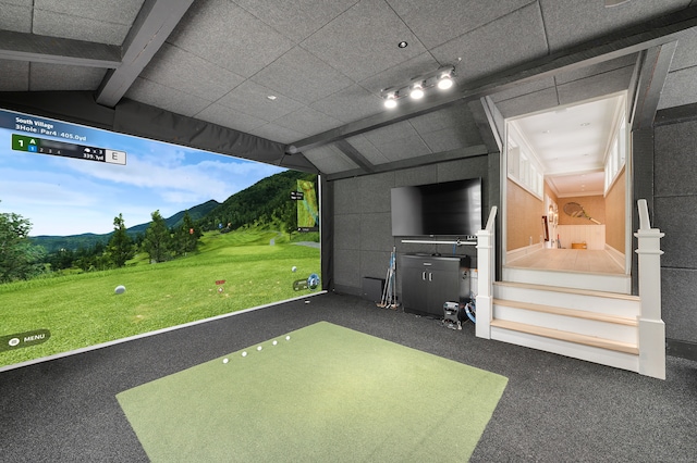 recreation room featuring vaulted ceiling with beams and carpet flooring