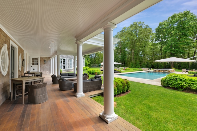 view of swimming pool featuring an outdoor hangout area, a yard, and a patio area