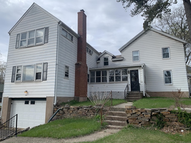 104 Union St, Vernon, CT 06066 - view of front of home featuring a chimney, an attached garage, and entry steps