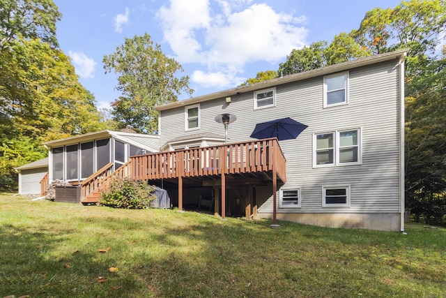 back of house featuring a wooden deck, a sunroom, and a lawn