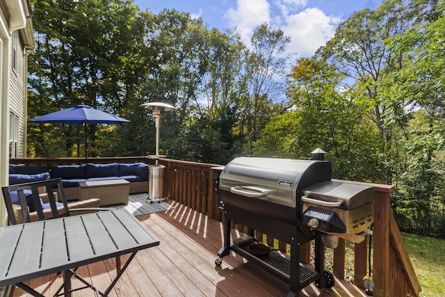 deck with an outdoor living space and area for grilling