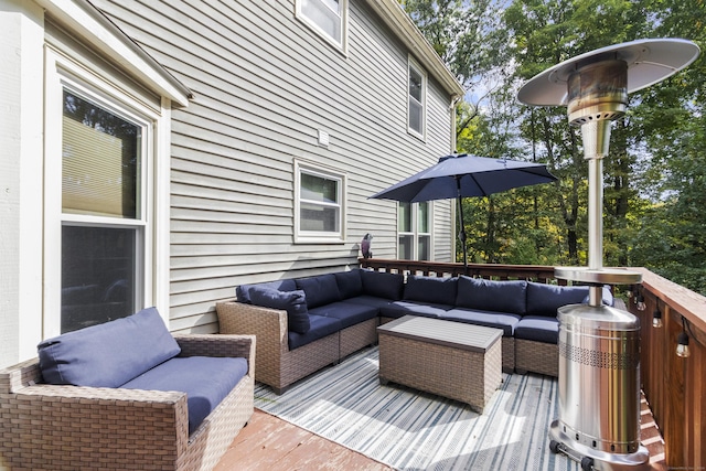 wooden terrace with an outdoor living space