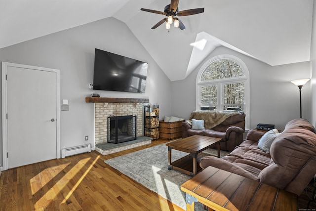 living room featuring hardwood / wood-style flooring, ceiling fan, baseboard heating, high vaulted ceiling, and a brick fireplace