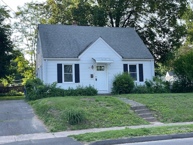 23 Nassau Cir E, Hartford, CT 06118 - view of front of house featuring a chimney and roof with shingles