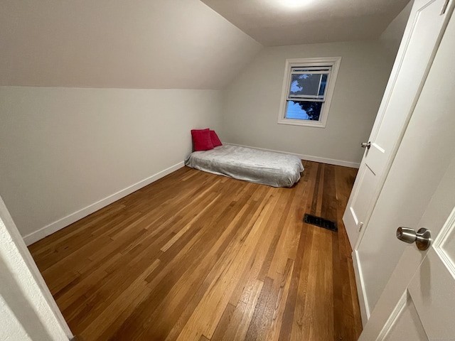 23 Nassau Cir E, Hartford, CT 06118 - unfurnished bedroom featuring wood-type flooring and vaulted ceiling