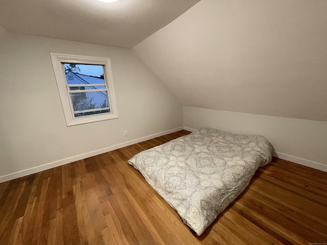 23 Nassau Cir E, Hartford, CT 06118 - bedroom with vaulted ceiling and wood finished floors