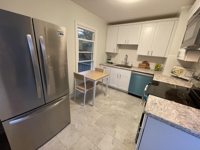 23 Nassau Cir E, Hartford, CT 06118 - kitchen featuring freestanding refrigerator, dishwashing machine, black microwave, range with electric cooktop, and light countertops