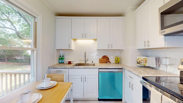 23 Nassau Cir E, Hartford, CT 06118 - kitchen with dishwasher, stainless steel microwave, electric stove, white cabinets, and crown molding