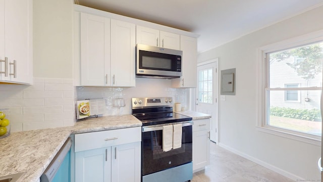 23 Nassau Cir E, Hartford, CT 06118 - kitchen featuring stainless steel appliances, electric panel, plenty of natural light, and decorative backsplash