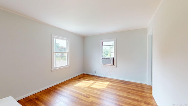23 Nassau Cir E, Hartford, CT 06118 - spare room with light wood-type flooring, crown molding, and cooling unit