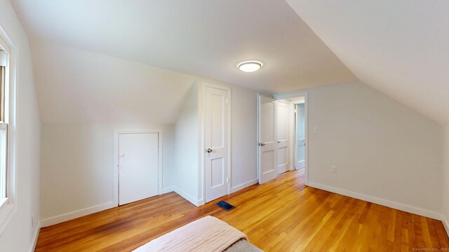 23 Nassau Cir E, Hartford, CT 06118 - bonus room with light wood-style flooring and vaulted ceiling