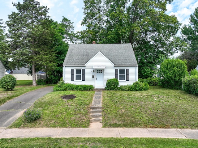 23 Nassau Cir E, Hartford, CT 06118 - view of front of home featuring a front lawn, a chimney, and a shingled roof