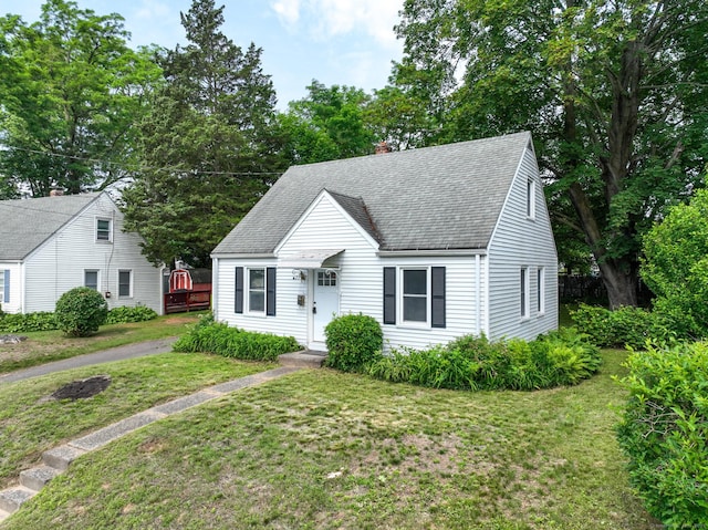 23 Nassau Cir E, Hartford, CT 06118 - cape cod house featuring roof with shingles, a front lawn, and a chimney