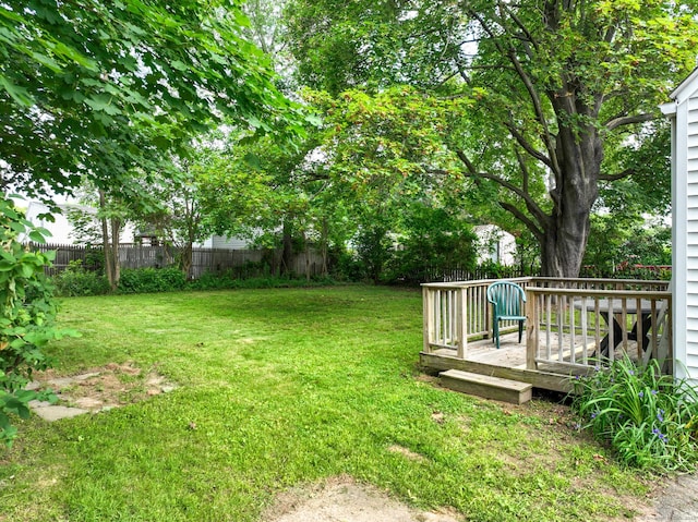 23 Nassau Cir E, Hartford, CT 06118 - fenced backyard with a wooden deck