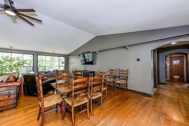 dining room featuring lofted ceiling, ceiling fan, and hardwood / wood-style flooring