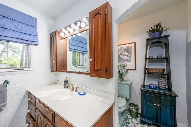 bathroom featuring vanity and toilet