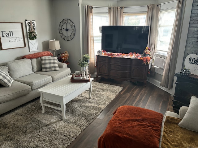 living room featuring cooling unit and dark wood-type flooring