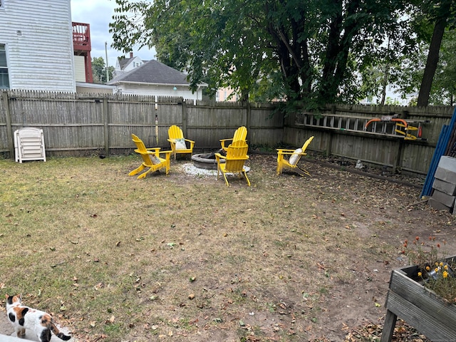 view of yard with a fire pit