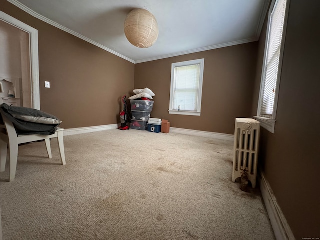 misc room with ornamental molding, radiator, a baseboard heating unit, and carpet flooring