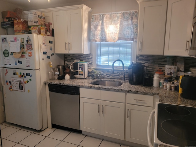 kitchen with white cabinets, sink, backsplash, dishwasher, and white fridge