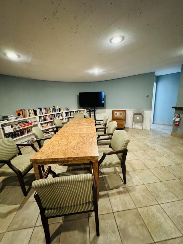 dining area with light tile patterned flooring and recessed lighting