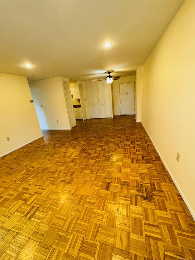 empty room featuring a ceiling fan, baseboards, and recessed lighting