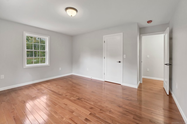 unfurnished bedroom featuring hardwood / wood-style flooring