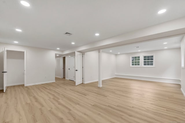 basement featuring light hardwood / wood-style flooring